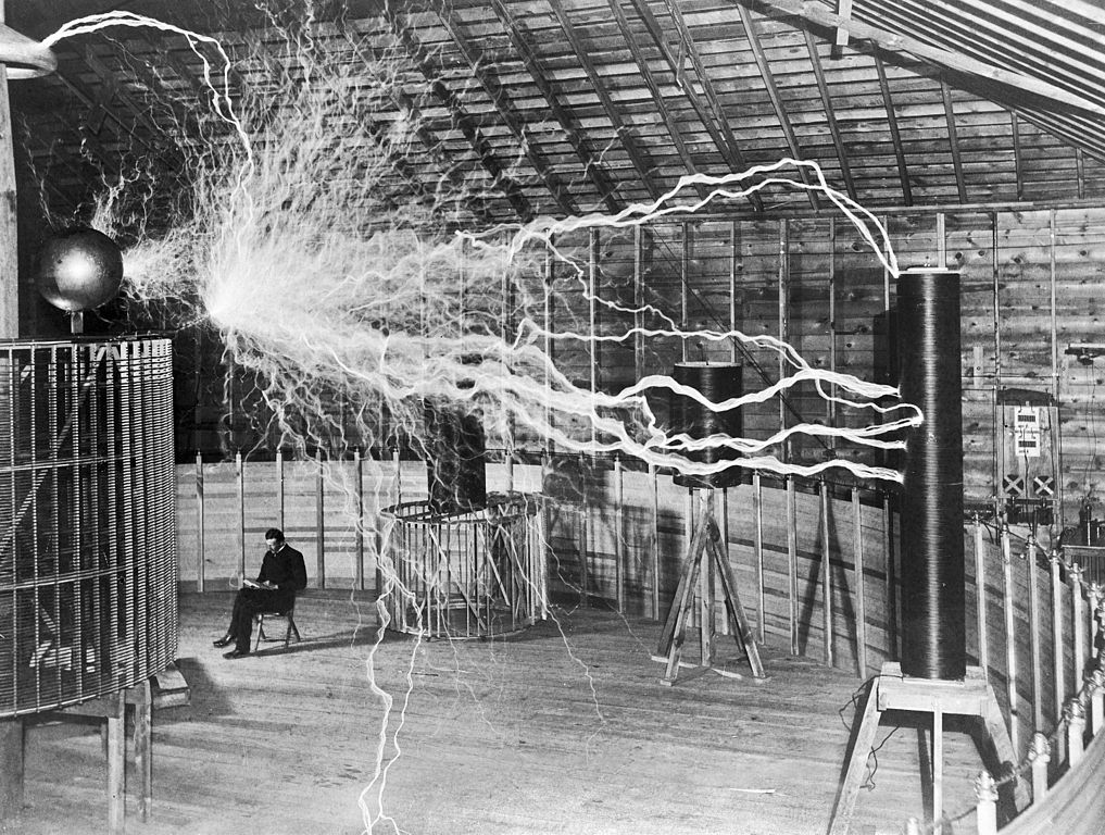 https://www.liberalcurrents.com/content/images/wordpress/2022/11/Nikola_Tesla_with_his_equipment_EDIT.jpg